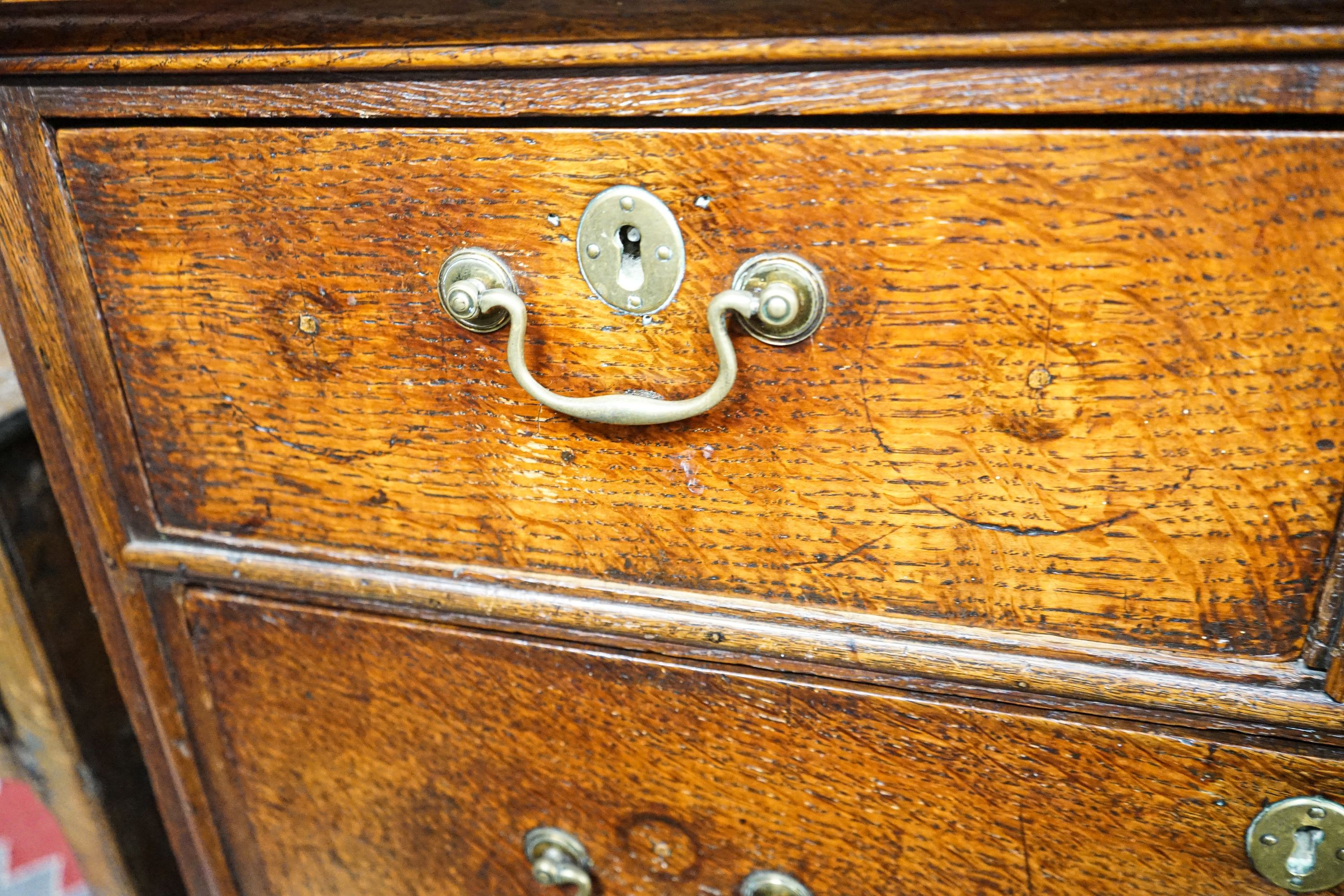 A George III oak chest of five drawers, on bracket feet, width 90cm, depth 52cm, height 103cm
